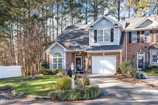 view of front facade with a garage and a front lawn