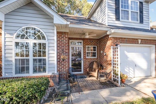 doorway to property featuring ceiling fan and a garage