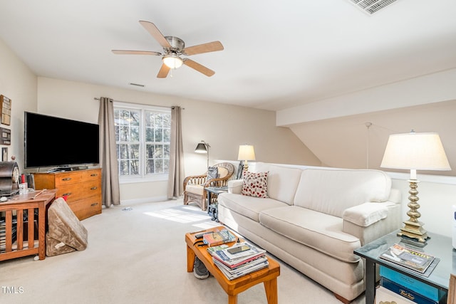 living room with ceiling fan, light colored carpet, and lofted ceiling