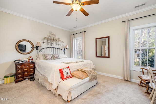 bedroom featuring ceiling fan, light colored carpet, and multiple windows