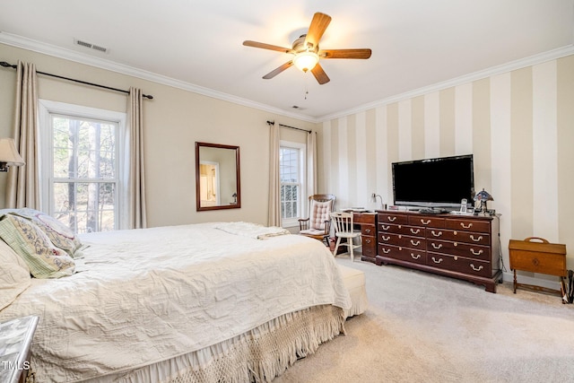 bedroom featuring ceiling fan, carpet, and ornamental molding