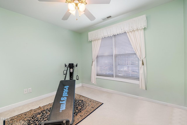 exercise room with ceiling fan