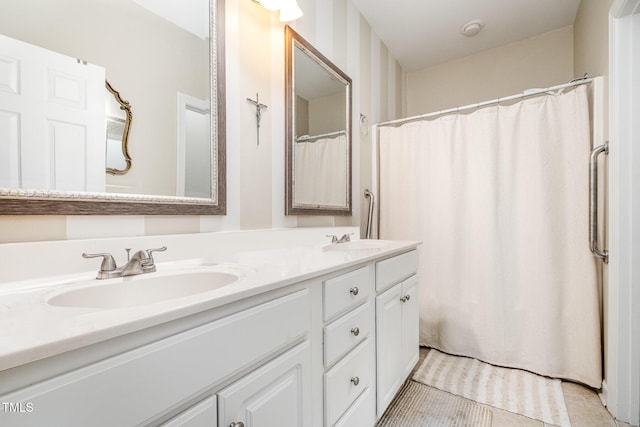 bathroom featuring tile patterned flooring and vanity