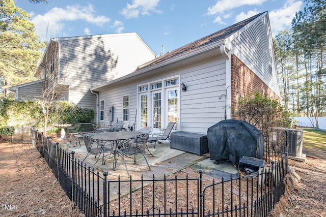 back of house featuring a patio and central AC