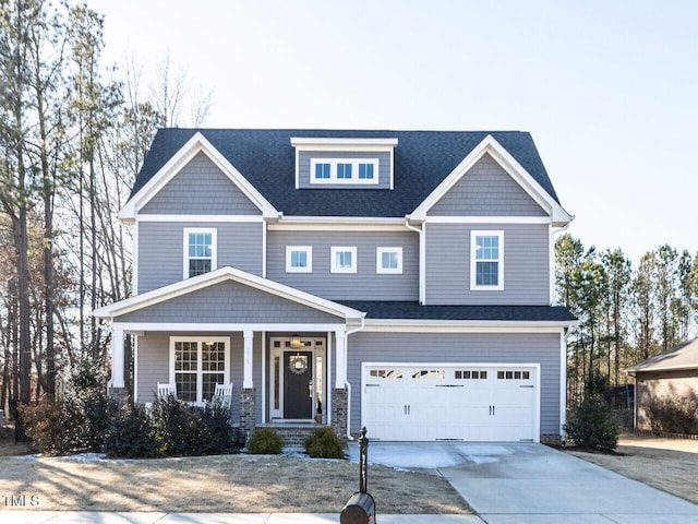 craftsman-style house with a porch and a garage