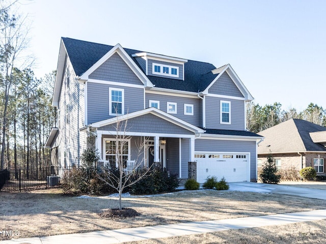 craftsman inspired home featuring central AC, a porch, and a garage