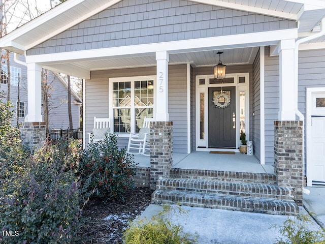 doorway to property featuring covered porch