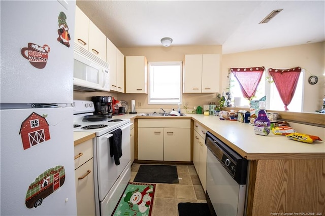 kitchen with sink and white appliances