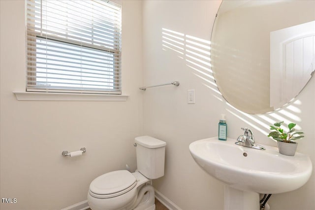 bathroom featuring sink and toilet