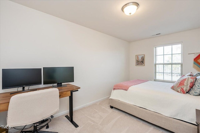 bedroom featuring light carpet