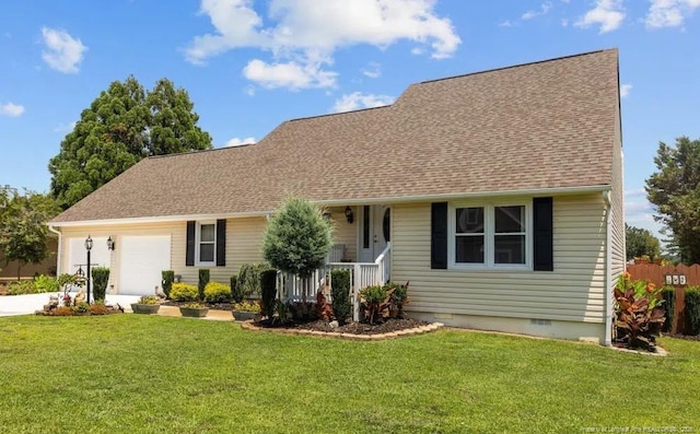 view of front of home featuring a garage, covered porch, and a front yard