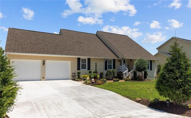 view of front of house with a garage and a front lawn