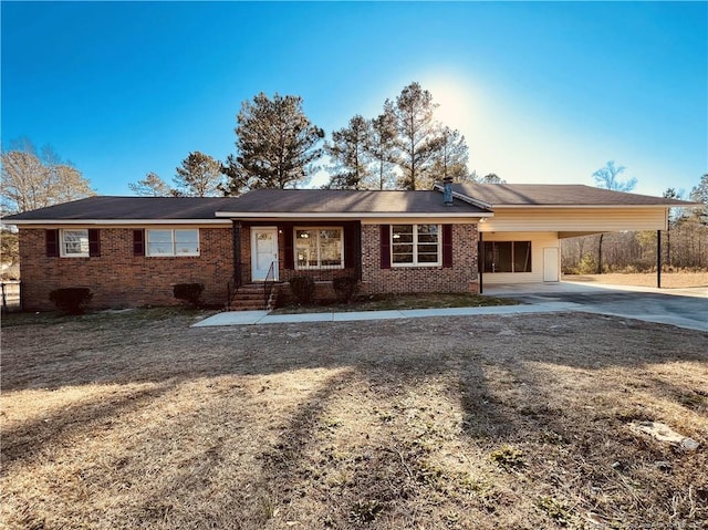 single story home featuring a carport