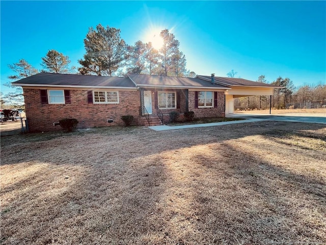 single story home with a carport and a front lawn