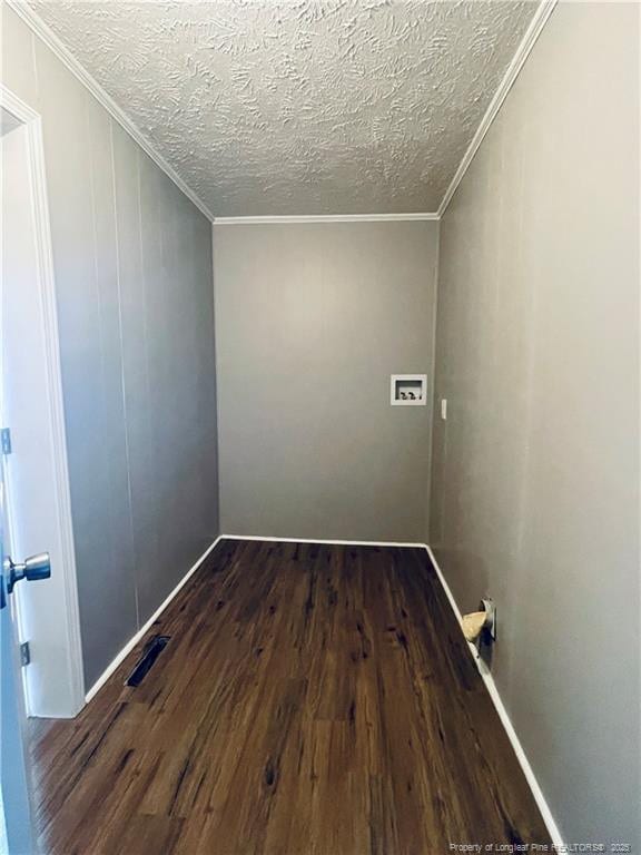 empty room featuring a textured ceiling and hardwood / wood-style flooring