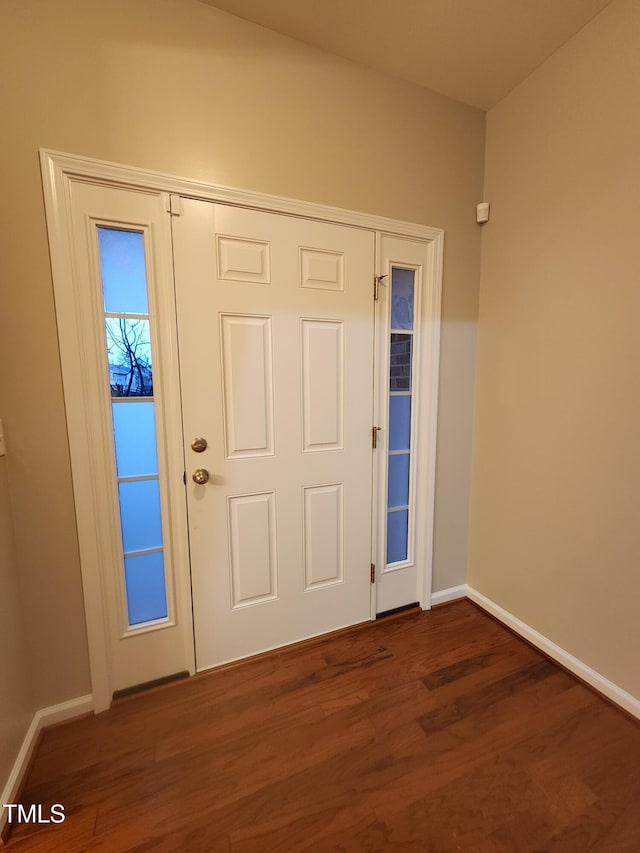 entrance foyer featuring dark hardwood / wood-style floors