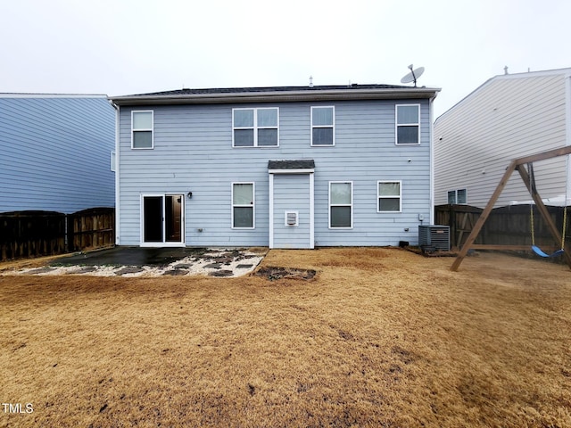 rear view of house featuring cooling unit