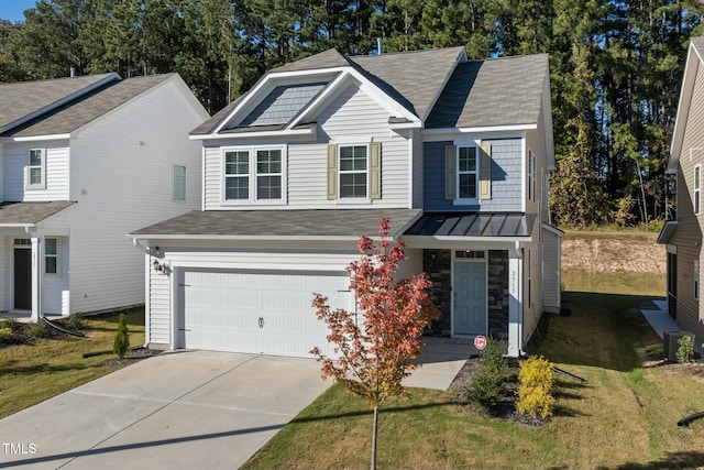 view of front of house featuring cooling unit, a front lawn, and a garage