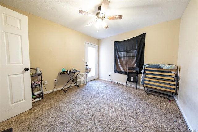 miscellaneous room with ceiling fan and carpet floors