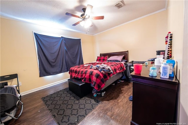 bedroom with a textured ceiling, ceiling fan, dark hardwood / wood-style flooring, and crown molding