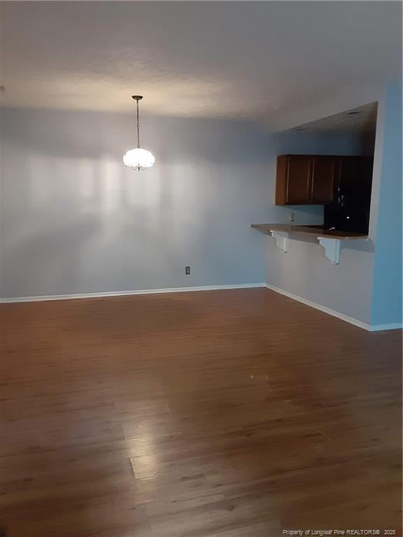 interior space with dark hardwood / wood-style floors