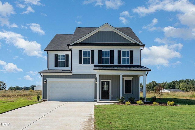 view of front facade featuring covered porch, a front yard, and a garage