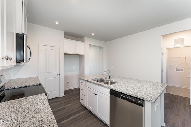 kitchen with dishwasher, white cabinetry, light stone countertops, and sink