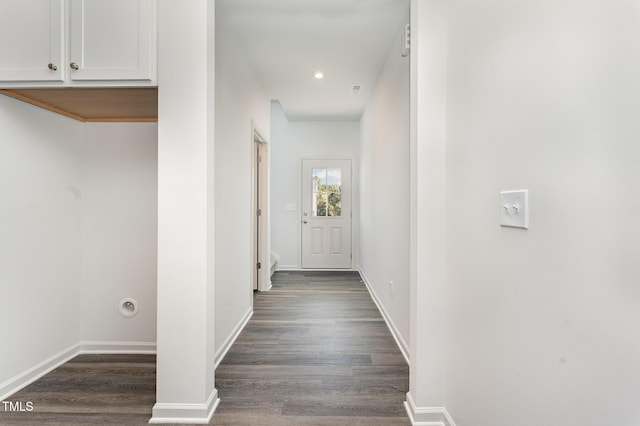 hallway with dark wood-type flooring