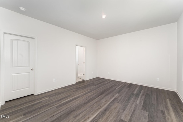 empty room featuring dark hardwood / wood-style floors