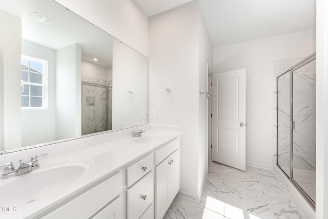 bathroom featuring vanity and a shower with shower door