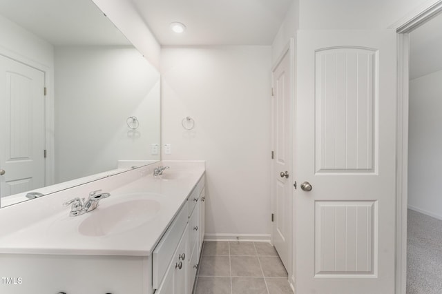 bathroom with tile patterned flooring and vanity