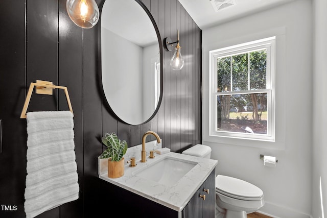 bathroom with vanity and toilet