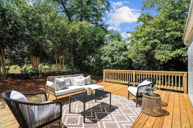 wooden deck with an outdoor living space