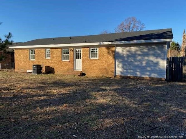 rear view of house featuring cooling unit