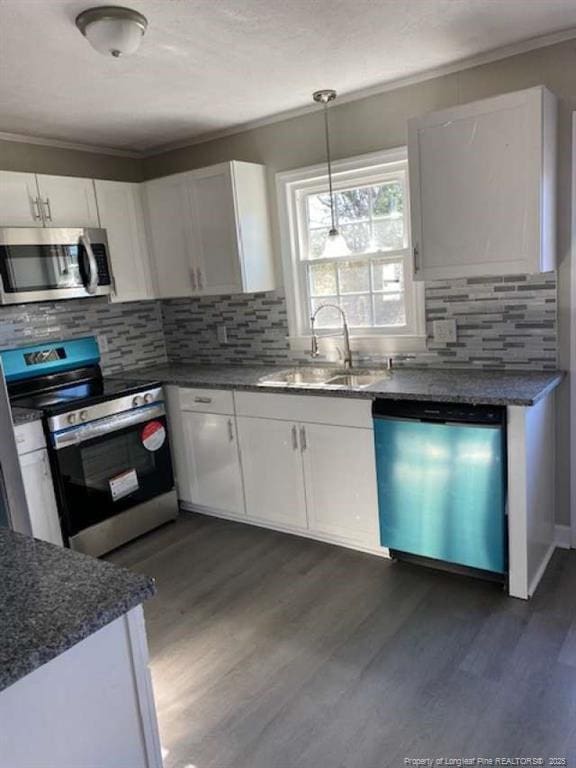 kitchen with white cabinetry and stainless steel appliances