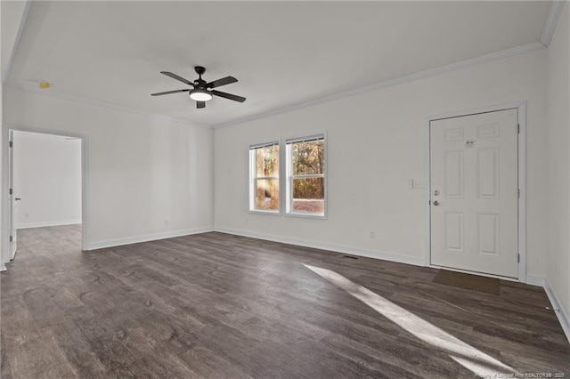 empty room with ceiling fan, dark hardwood / wood-style flooring, and ornamental molding