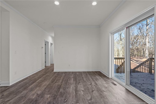 unfurnished room with dark hardwood / wood-style floors and crown molding