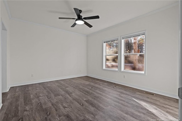 spare room with dark hardwood / wood-style floors, ceiling fan, and ornamental molding