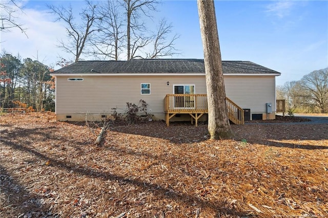 back of house featuring cooling unit and a deck