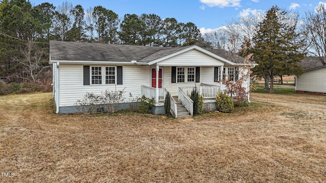 ranch-style house with a porch and a front lawn