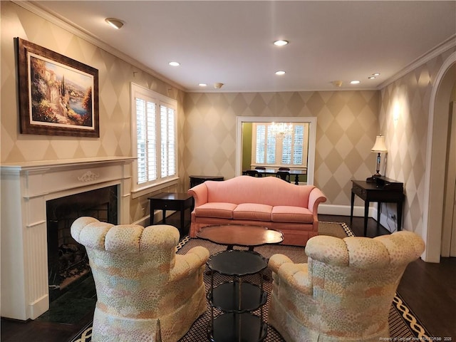 living room with hardwood / wood-style flooring and crown molding