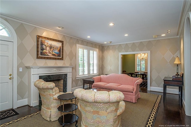 living area with baseboards, dark wood-style flooring, ornamental molding, and wallpapered walls