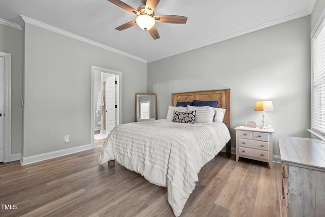 bedroom with connected bathroom, ceiling fan, hardwood / wood-style floors, and crown molding