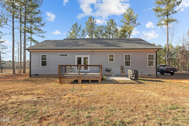 back of house featuring a yard, a patio, and a wooden deck