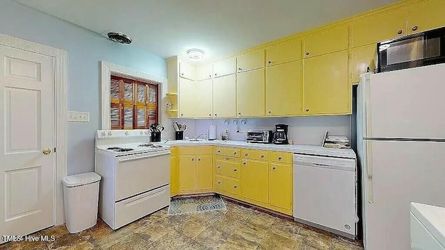 kitchen featuring white appliances and sink