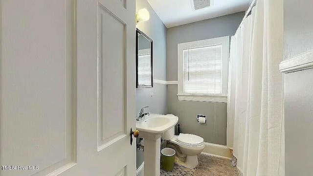 bathroom with sink and toilet