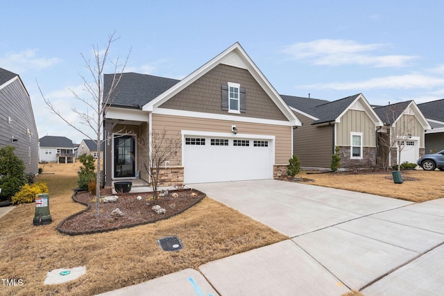 craftsman-style house featuring a garage and a front lawn