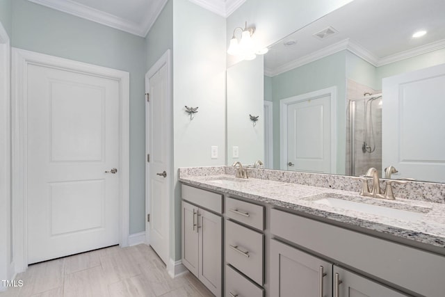 bathroom featuring vanity, an enclosed shower, and ornamental molding