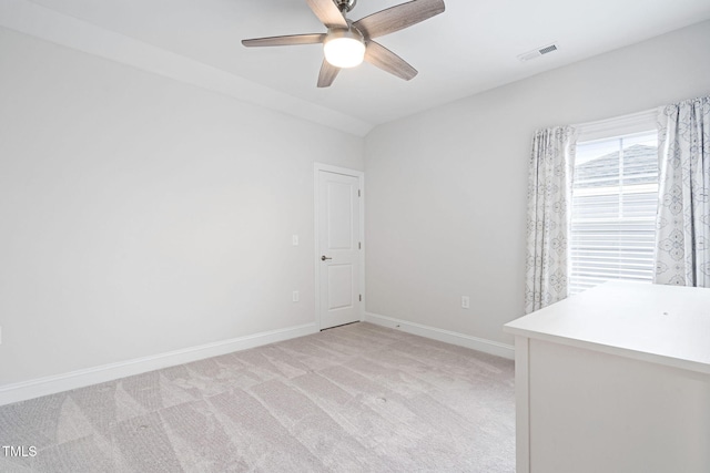 empty room with light colored carpet and ceiling fan