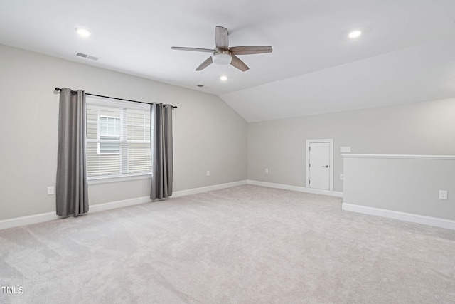 bonus room featuring ceiling fan, light colored carpet, and vaulted ceiling